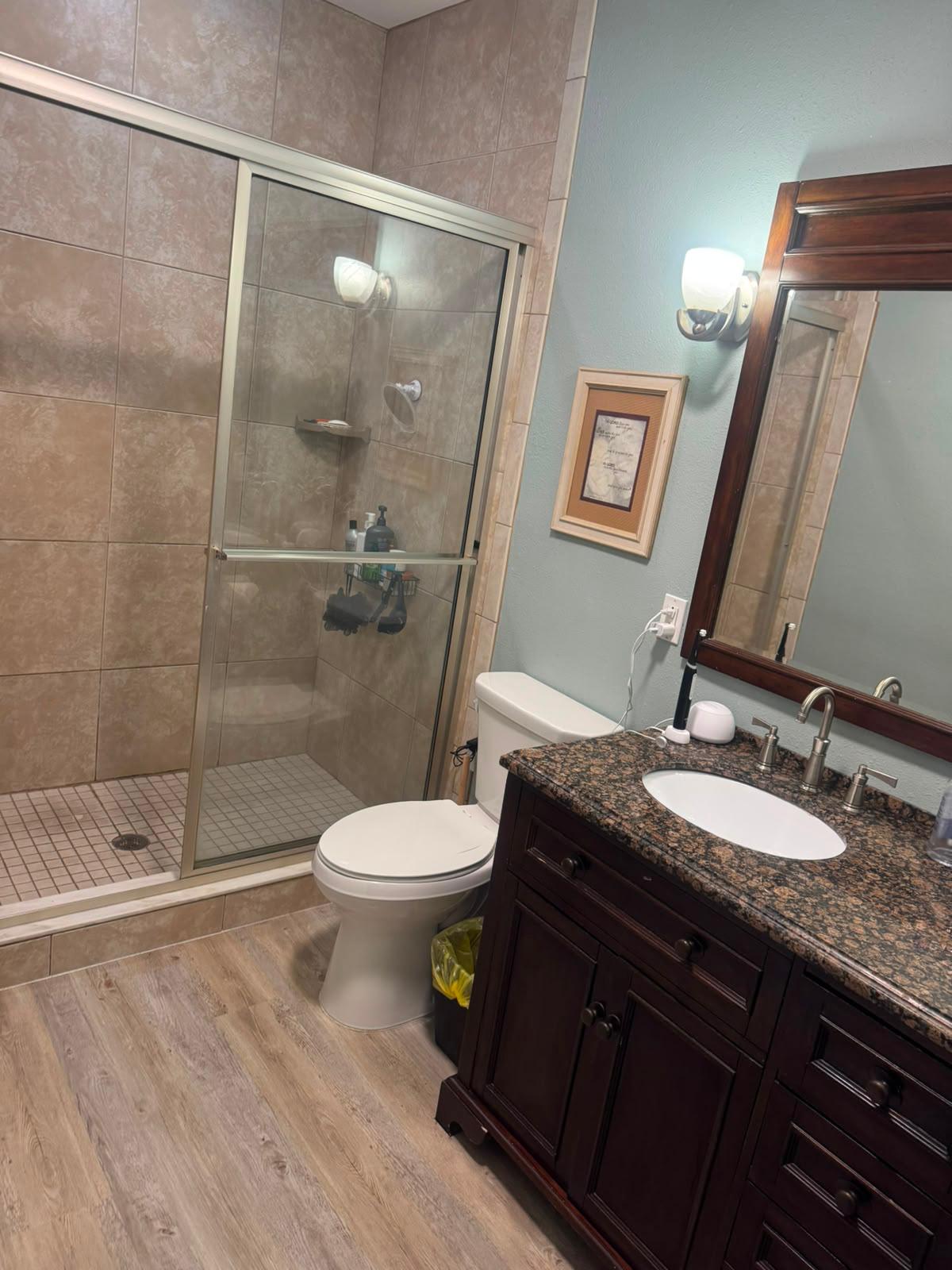 Full bathroom detailed from shower tile to floors