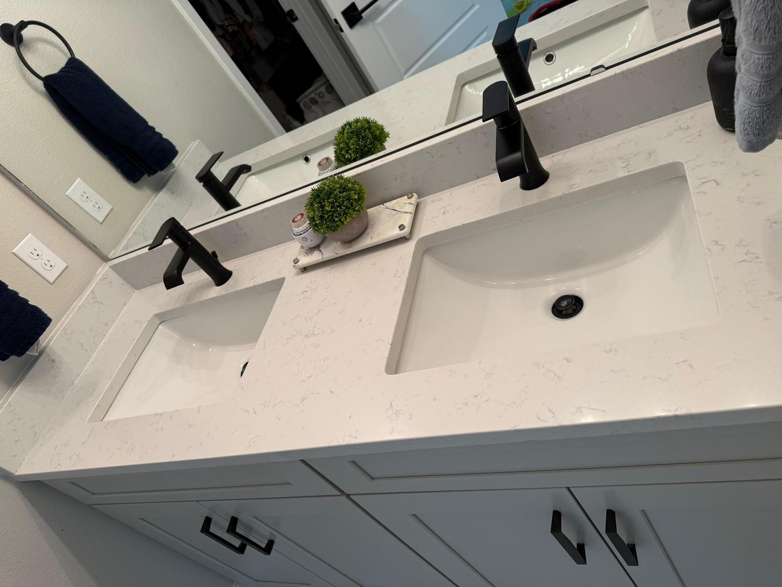 Sparkling white quartz double vanity after a Ruffo Service cleaning in Orlando